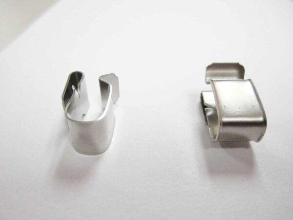 Two metal clips on a white background.