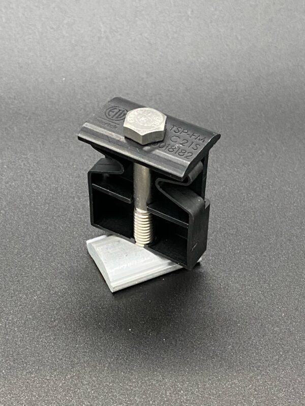 Black plastic solar panel mounting clamp.