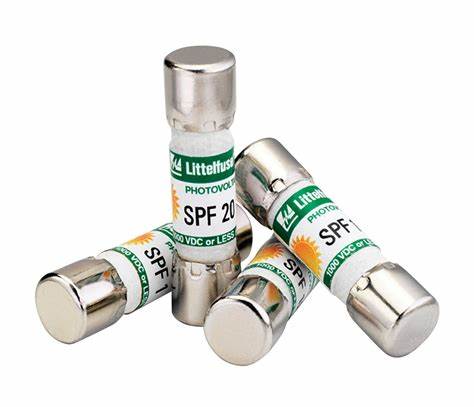 Four 15 Amp Littlefuse SPF-015 fuses on a white background.