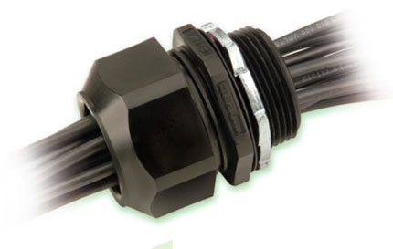 A Heyco M4524GBM-SM connector with two wires on it.