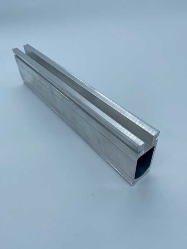 Aluminum extruded profile on white background.