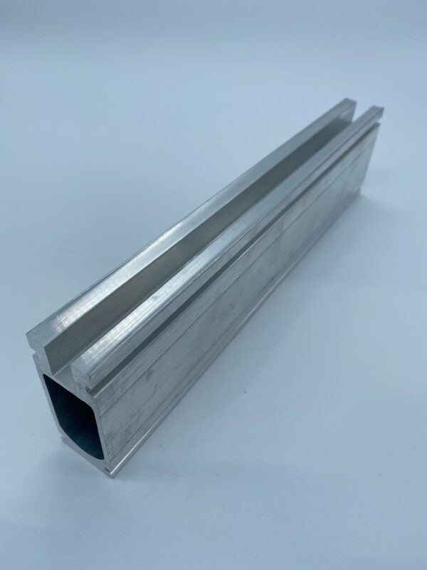 Aluminum extruded rectangular profile on white background.